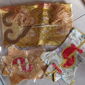 Three silk and satin covers for gift bottles